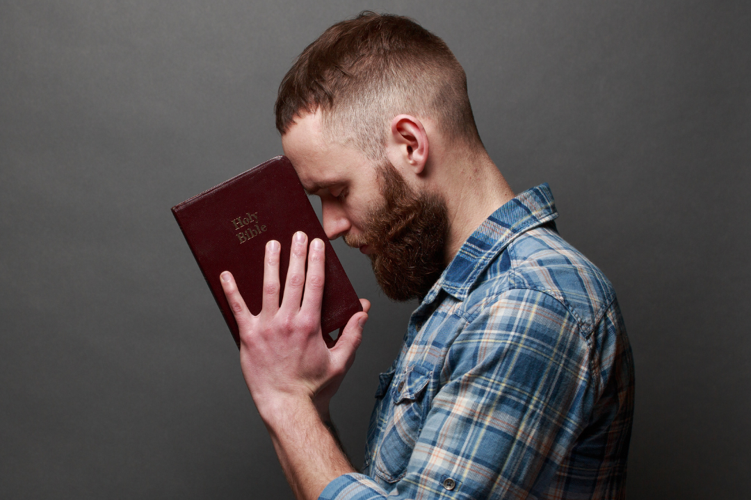 Man holding the Bible - Bachelor of Arts